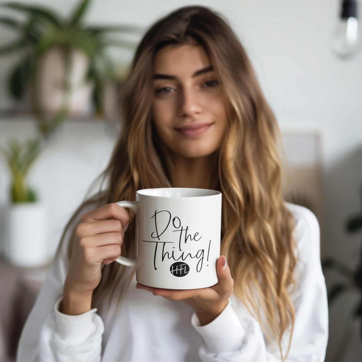 Do_the_Thing_mug_2-sided_print_Model_Holding_LH_Mockup.png